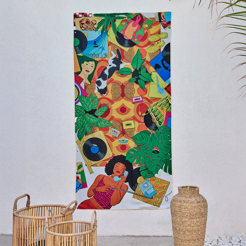 Sweet Reminiscence art beach towel by Alícia Ribeiro, a colourful 90s scene with vinyl records, hanging on a wall