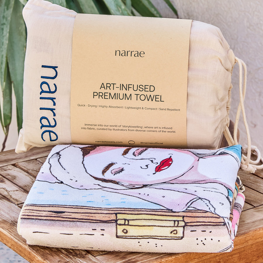 Me Time beach towel folded with its Narrae drawstring bag